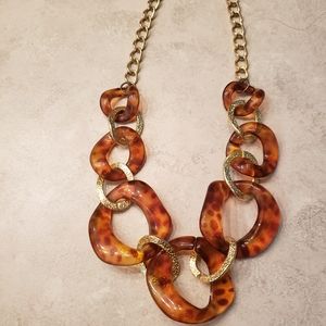 Stylish brown and gold, animal print necklace.